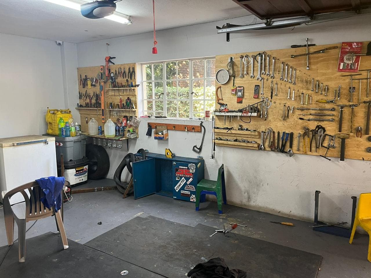 Spanners and sockets laid out on the workshop tool boards