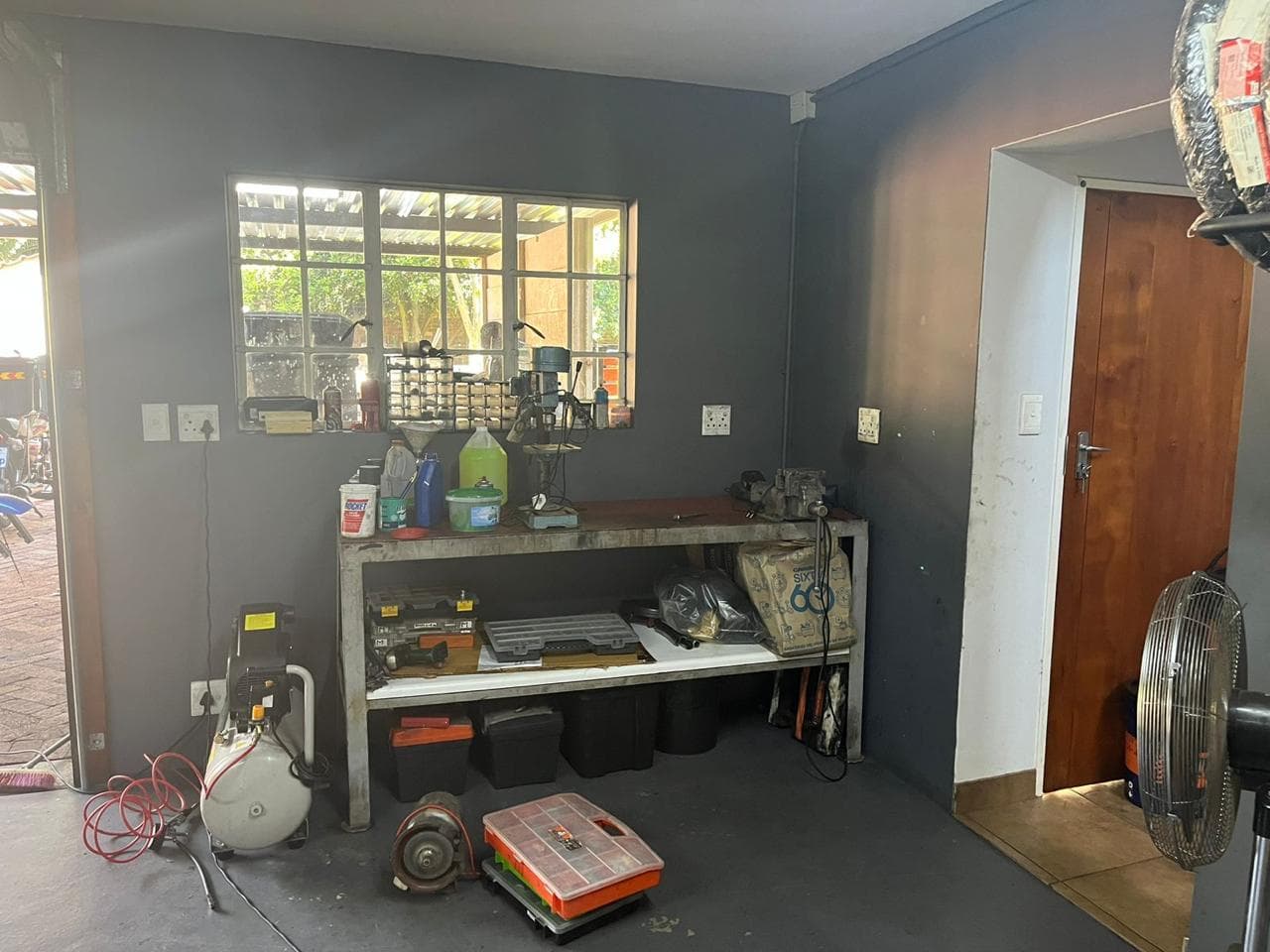 Workbench with pillar drill and vice
